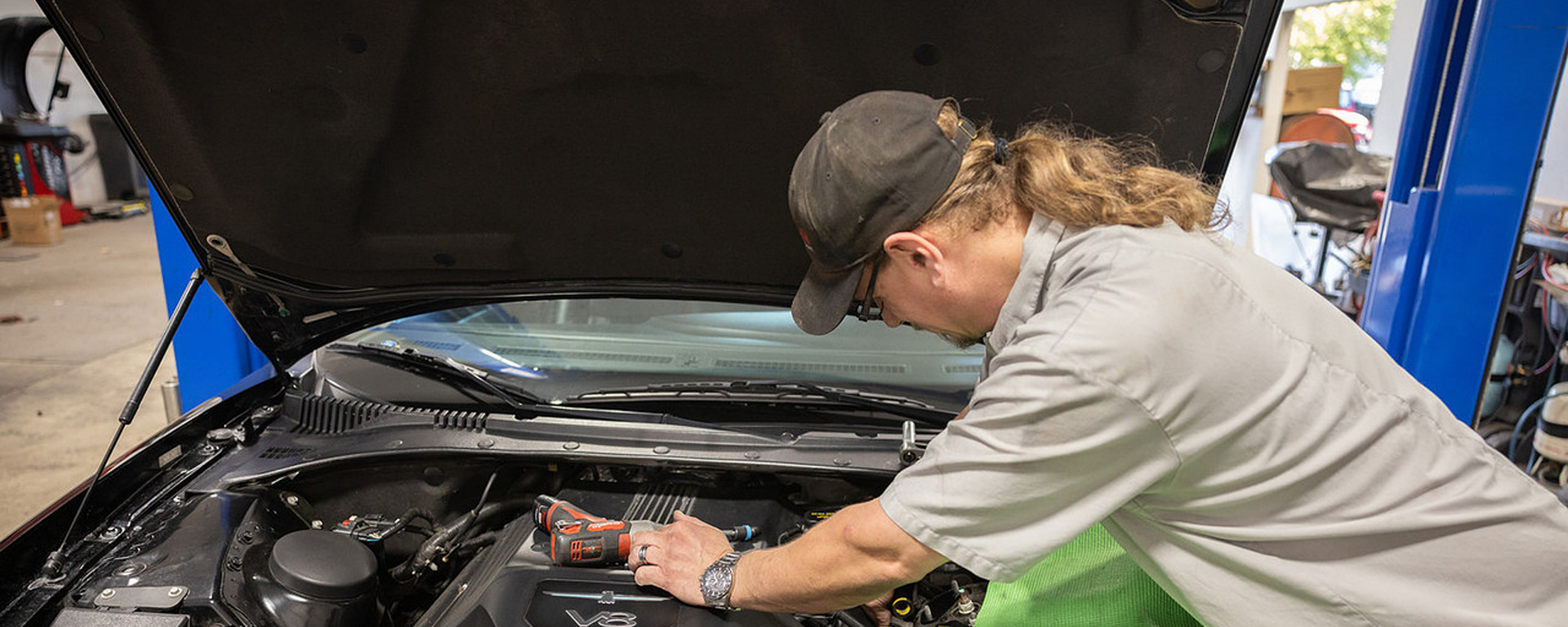 Jeremy repairing vehicle in garage | AutoWorks